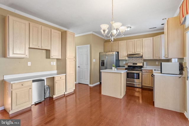 kitchen with dark wood-style floors, light brown cabinets, appliances with stainless steel finishes, and a center island