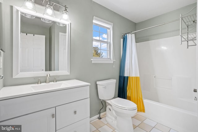 bathroom featuring shower / bath combo with shower curtain, toilet, vanity, and baseboards