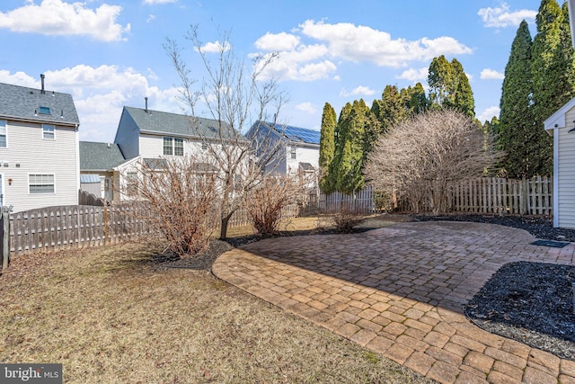 view of yard featuring a patio area and a fenced backyard