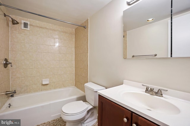 full bath featuring toilet, visible vents, vanity, and tub / shower combination