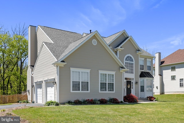 view of front of house with a front lawn, fence, aphalt driveway, a chimney, and a garage