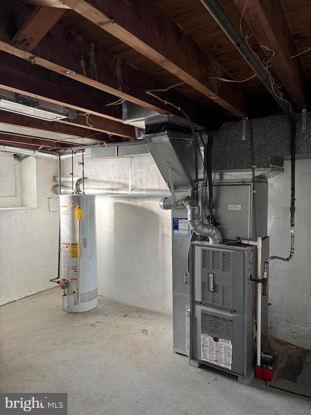 unfinished below grade area featuring heating unit and gas water heater