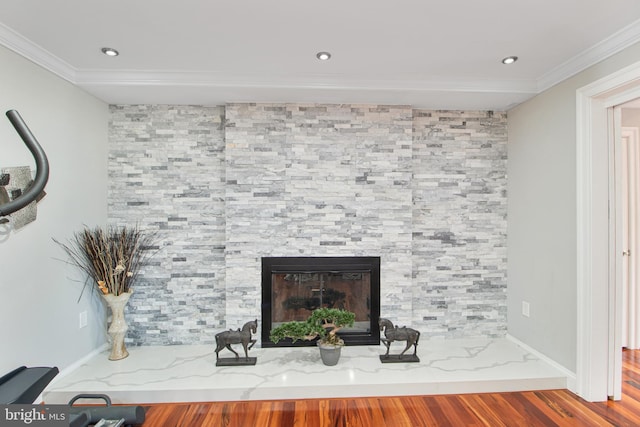 room details featuring recessed lighting, a fireplace, wood finished floors, and crown molding