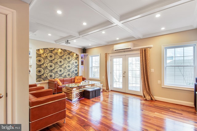 interior space with wood finished floors, coffered ceiling, a wall mounted AC, french doors, and beamed ceiling