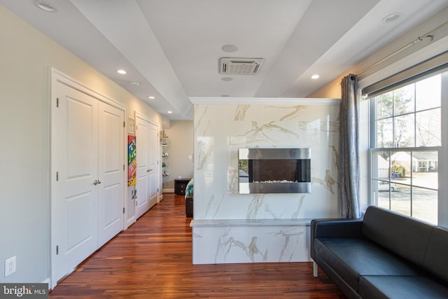 interior space featuring dark wood finished floors, recessed lighting, and visible vents