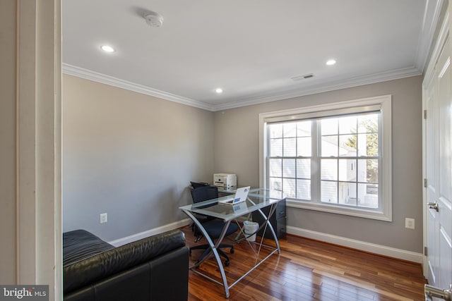 office space featuring baseboards, visible vents, recessed lighting, wood-type flooring, and crown molding