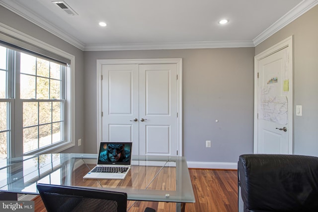 office area with a wealth of natural light, visible vents, dark wood-type flooring, and baseboards