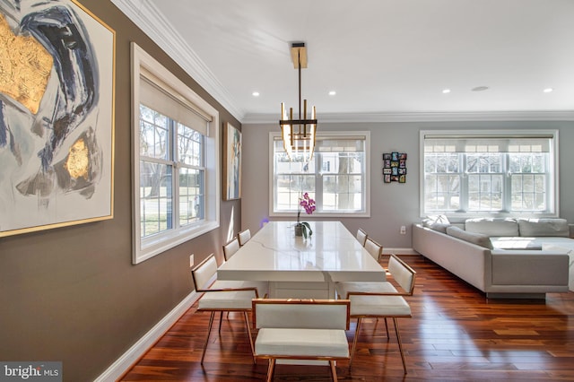 dining room with baseboards, recessed lighting, dark wood-style flooring, ornamental molding, and a chandelier