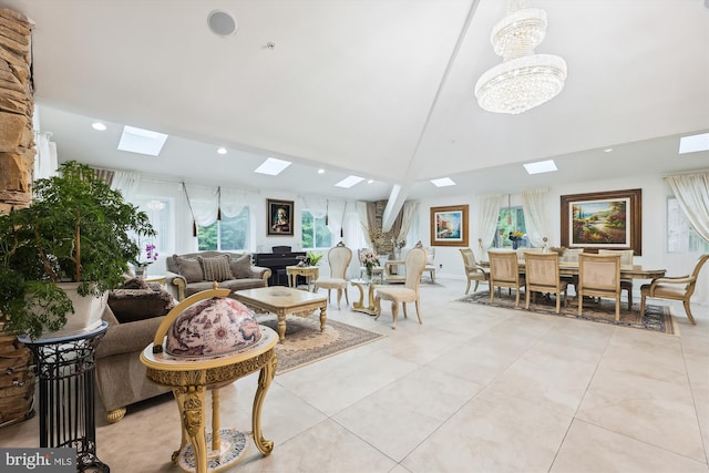 living area featuring high vaulted ceiling, recessed lighting, a skylight, light tile patterned floors, and a chandelier