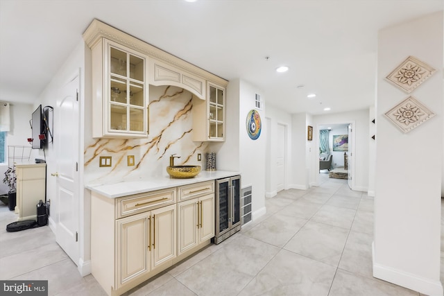 bar featuring tasteful backsplash, recessed lighting, wine cooler, light tile patterned flooring, and a dry bar