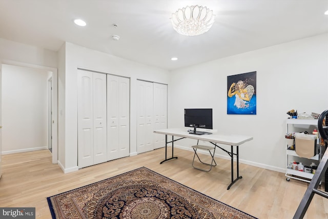 home office featuring recessed lighting, a chandelier, and light wood-style flooring