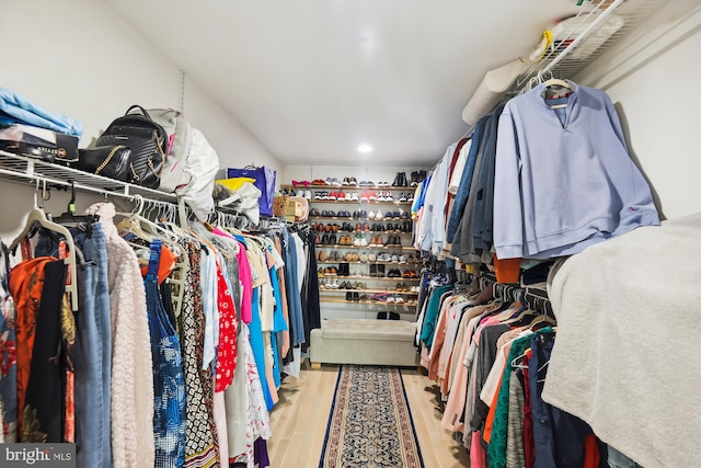 spacious closet with wood finished floors