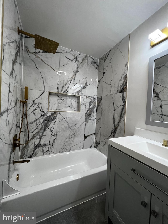 bathroom with vanity and a combined bath / shower with marble appearance