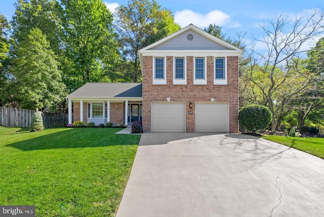 view of front of property with fence, concrete driveway, a front yard, a garage, and brick siding