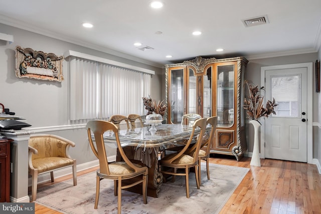 dining area with recessed lighting, light wood-style floors, visible vents, and ornamental molding