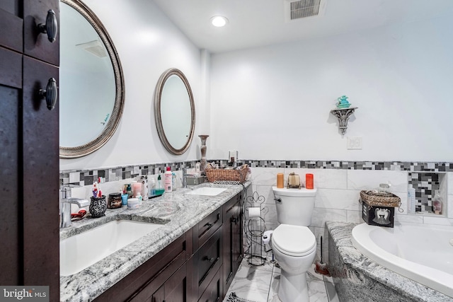 bathroom with toilet, visible vents, marble finish floor, and a sink