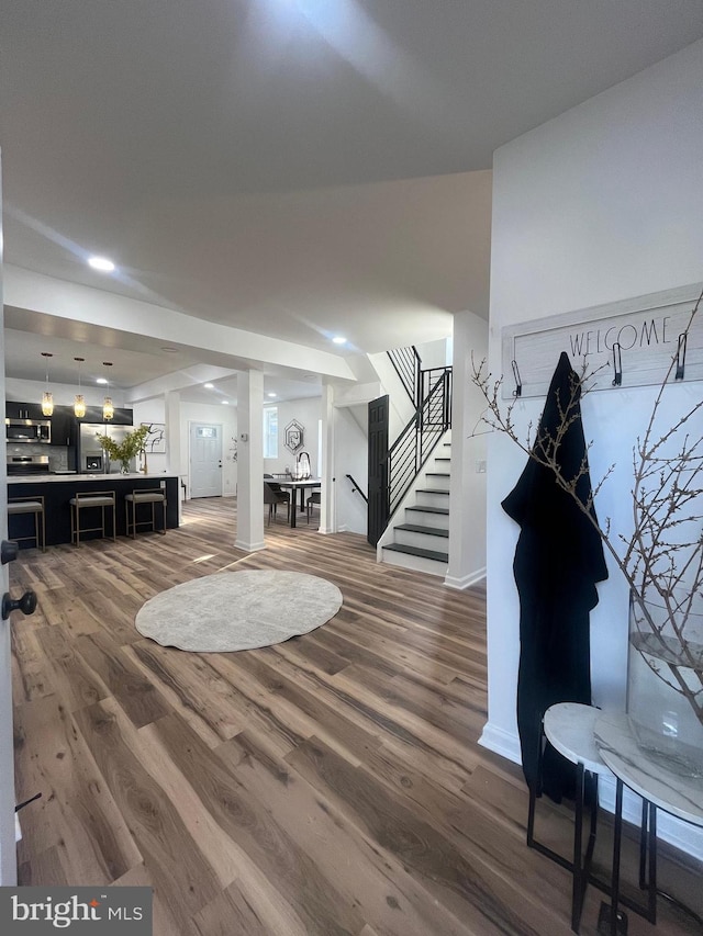 interior space with stairs and wood finished floors