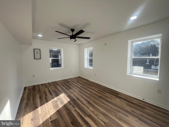 empty room with recessed lighting, baseboards, dark wood-style floors, and a ceiling fan