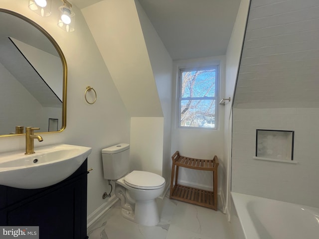 bathroom featuring vanity, baseboards, vaulted ceiling, toilet, and marble finish floor