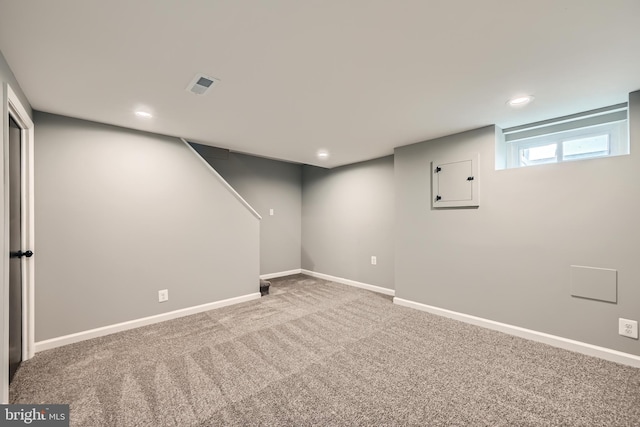 below grade area featuring visible vents, recessed lighting, baseboards, and carpet floors