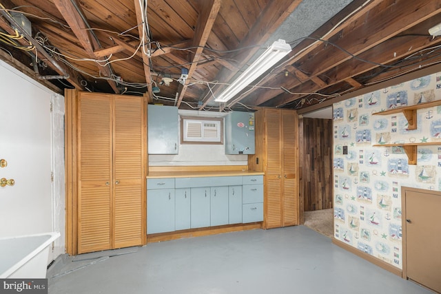 unfinished basement featuring electric panel