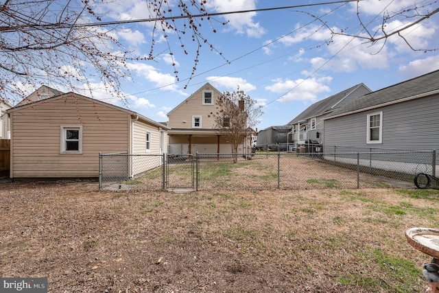 view of yard with a gate and a fenced backyard