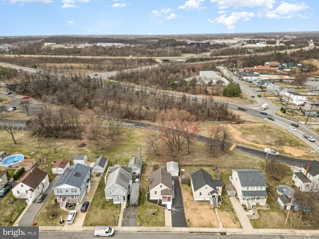 birds eye view of property with a residential view