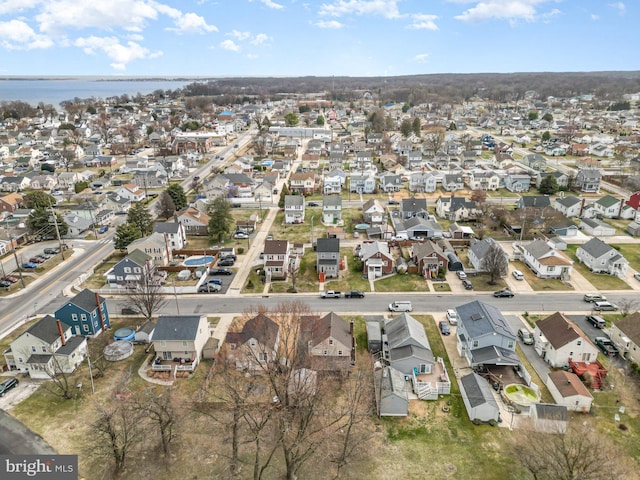 birds eye view of property with a residential view and a water view