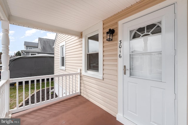 doorway to property featuring a porch