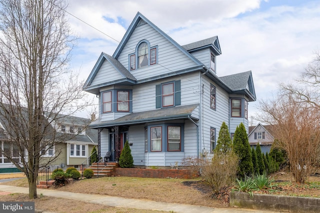 view of front of house featuring a shingled roof