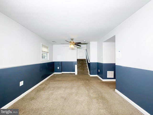2204 Holly Oak Ct, Waldorf, MD 20601 - carpeted empty room with stairs, visible vents, baseboards, and a ceiling fan