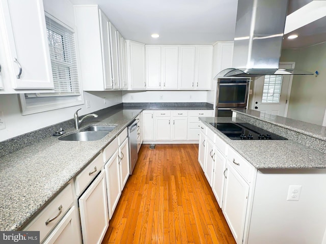 2204 Holly Oak Ct, Waldorf, MD 20601 - kitchen with light wood-type flooring, island range hood, white cabinetry, stainless steel appliances, and a sink