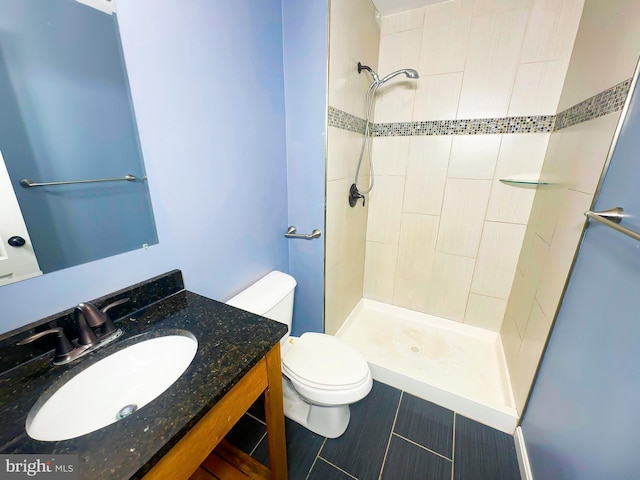 2204 Holly Oak Ct, Waldorf, MD 20601 - bathroom featuring toilet, vanity, and a tile shower