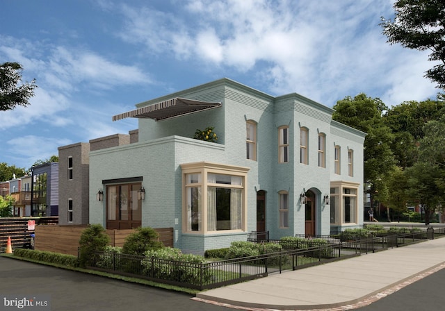 view of front of property featuring a fenced front yard and brick siding