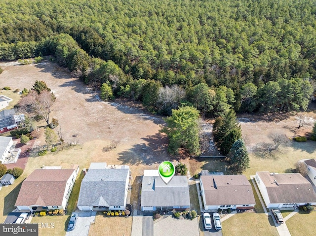 bird's eye view with a forest view and a residential view