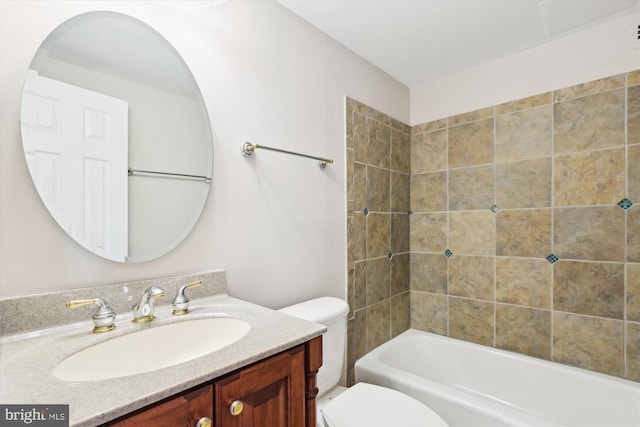 bathroom with shower / bathtub combination, toilet, and vanity