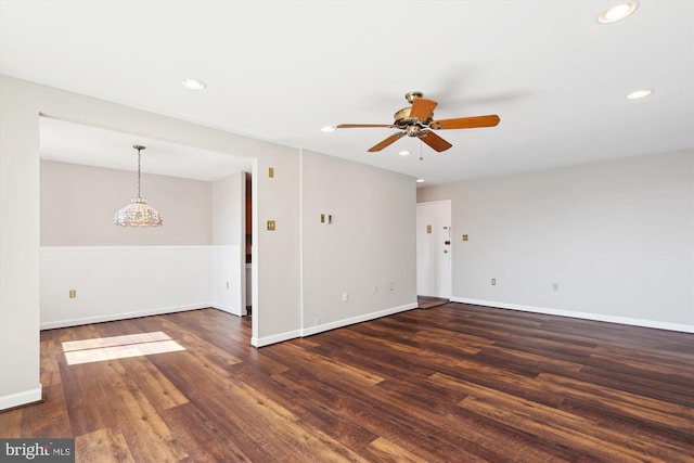 spare room featuring baseboards, recessed lighting, dark wood-style flooring, and ceiling fan