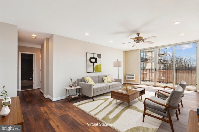 living room with baseboards, a wall of windows, recessed lighting, wood finished floors, and a ceiling fan