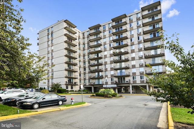 view of property featuring uncovered parking