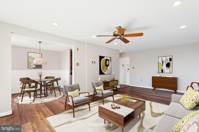 living room with a ceiling fan, recessed lighting, wood finished floors, and baseboards