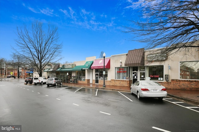 view of property with uncovered parking