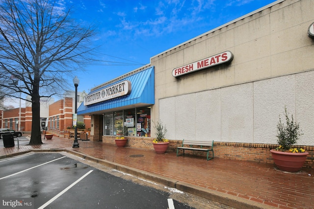 view of property featuring uncovered parking