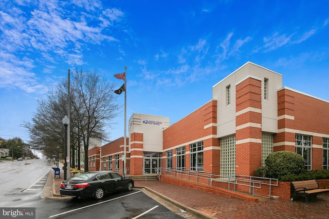 view of property featuring uncovered parking