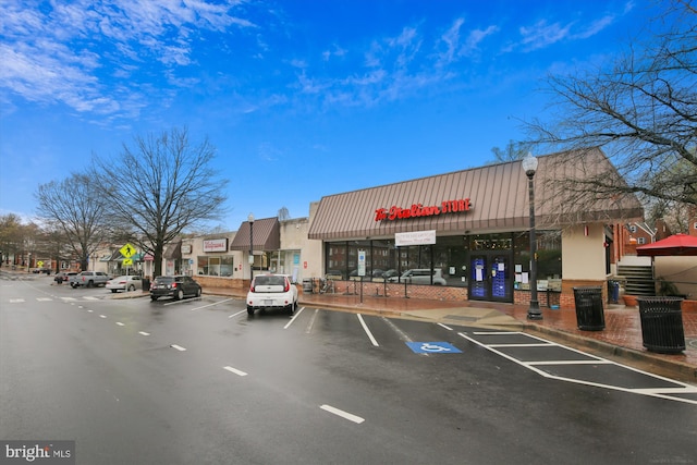 view of property featuring uncovered parking