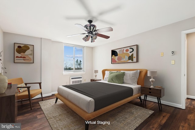 bedroom with baseboards, dark wood-style floors, a ceiling fan, and a wall unit AC