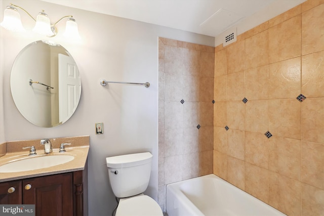 full bathroom with visible vents, toilet, bathtub / shower combination, and vanity