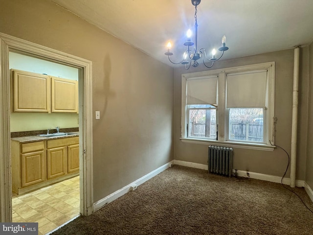 unfurnished dining area with a sink, light colored carpet, a chandelier, and radiator heating unit