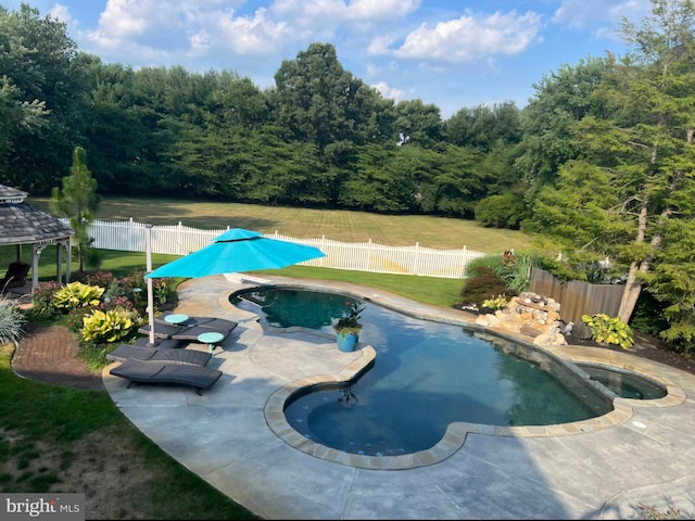 view of pool with a gazebo, a fenced in pool, a patio, and a fenced backyard