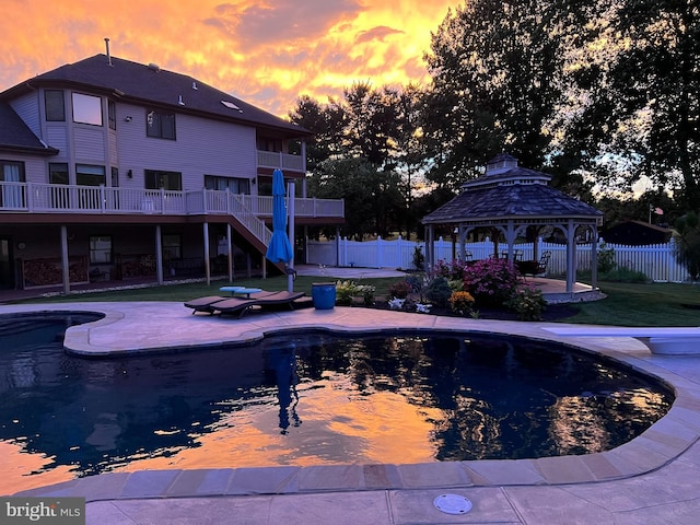 view of swimming pool featuring a gazebo, a fenced in pool, fence, and a patio