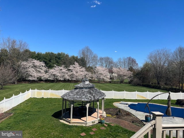 view of yard with a gazebo, a fenced in pool, and a fenced backyard